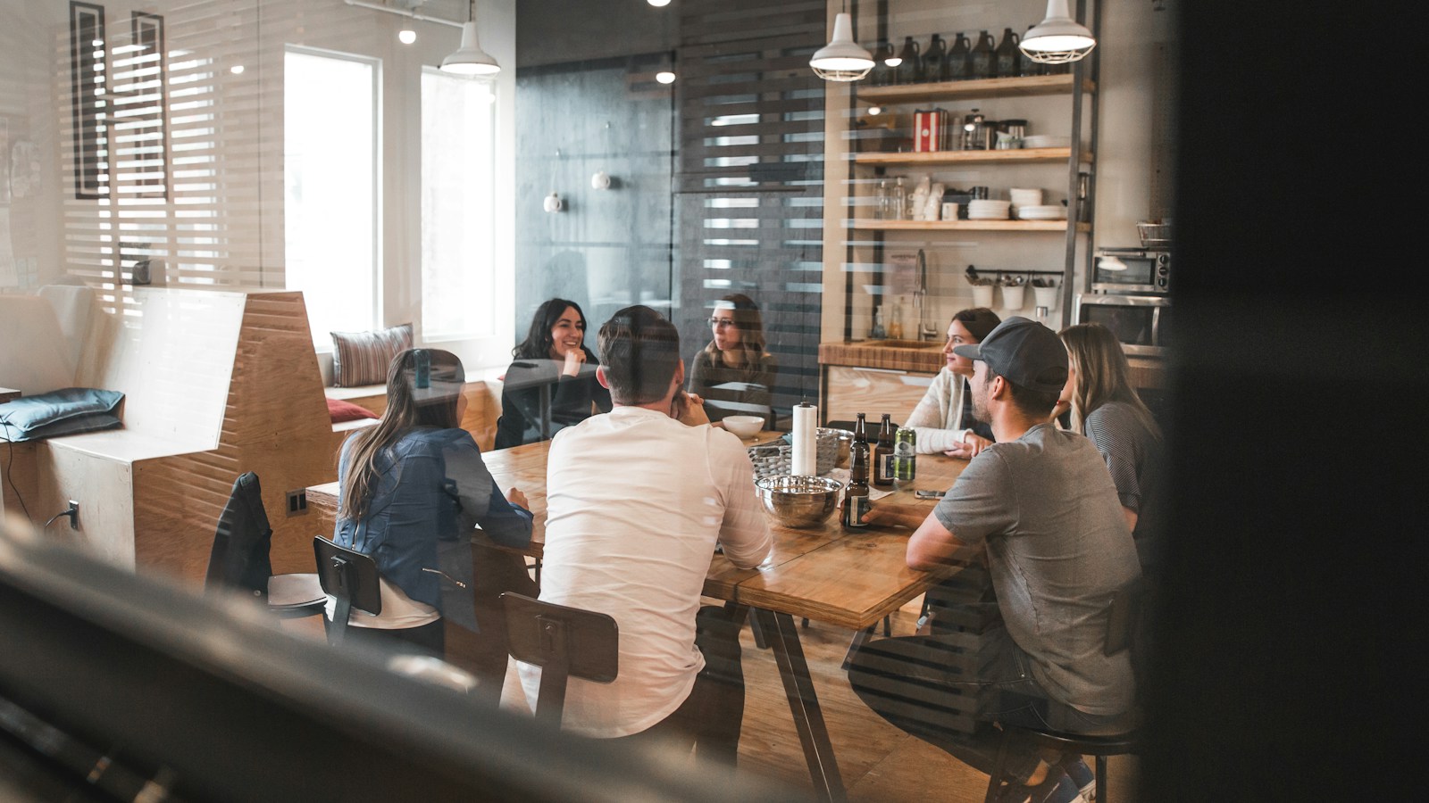 Small business team meeting around a conference table to discuss HR options
